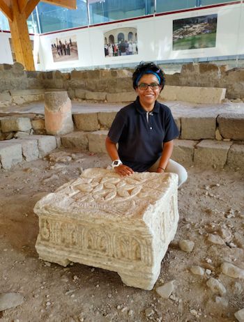 Fig. 1. The Magdala Stone (replica) and Marcela Zapata-Meza, the head of the Mexican Universidad Anahuac expedition. Photograph by the author, 2018.