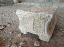 Fig. 9. A narrow side (back?) of the Magdala Stone (replica) decorated with two rosettes and arches. Photograph by the author, July 2018.